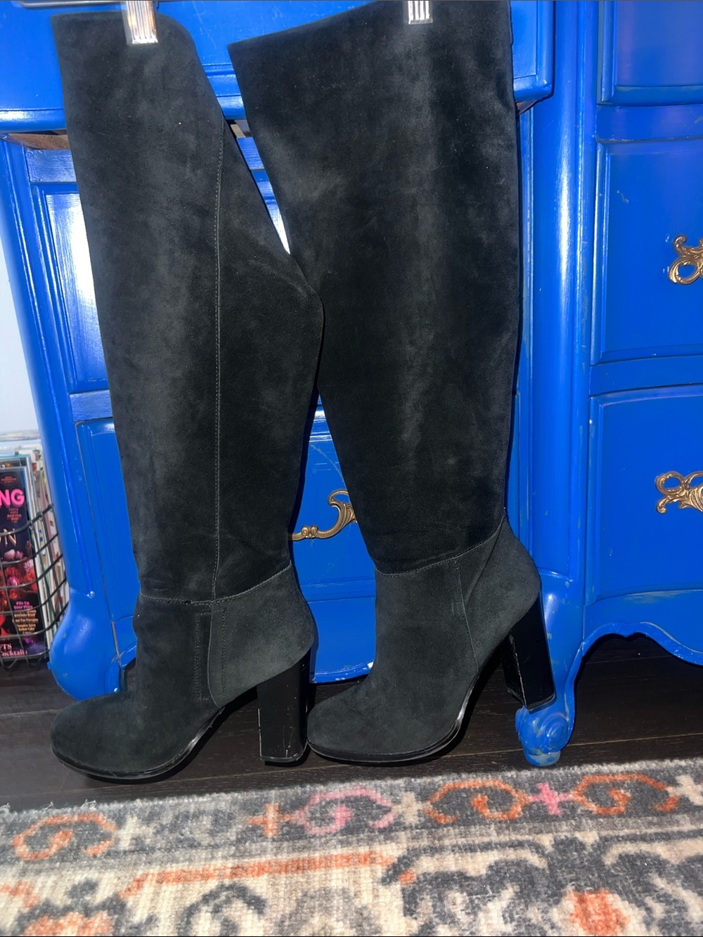 Tall suede heeled boots.